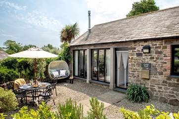 The sheltered courtyard is the ideal spot for dining alfresco or simply relaxing