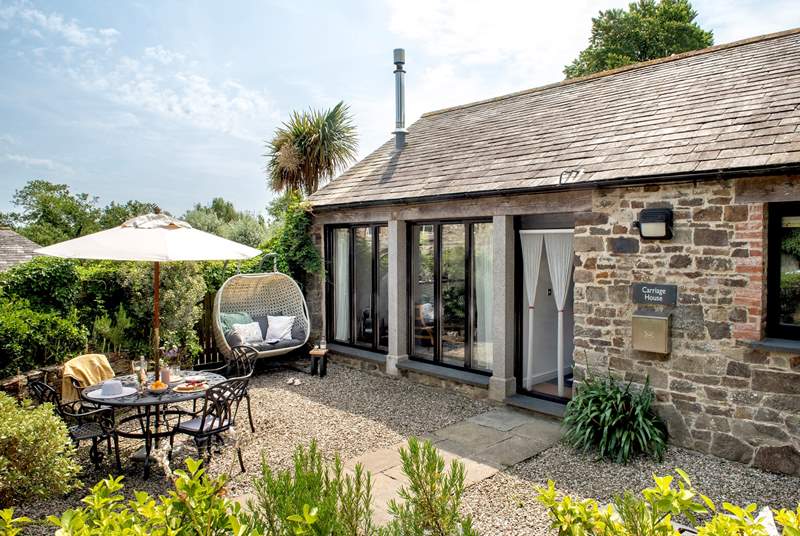 The sheltered courtyard is the ideal spot for dining alfresco or simply relaxing