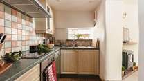 Cook up a holiday feast in the well-equipped kitchen with the sitting-room just next door.