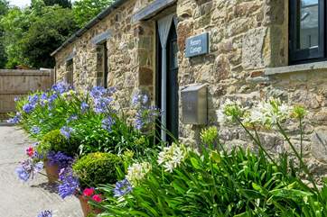 The flowers around the front door put on a beautiful show