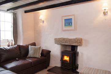 The second sitting-room where there are sea views from the small traditional cottage windows.