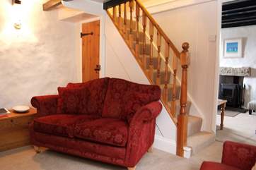 Stairs lead up to the two bedrooms from the first sitting-room.