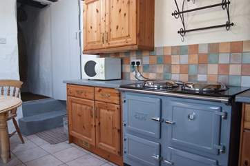 The kitchen is warmed by an electric ESSE range cooker.
