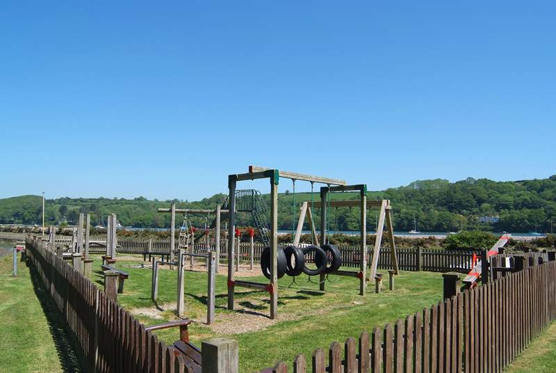The children's play-park in Golant, safely fenced by the inner harbour.