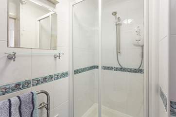 The handy shower-room is just by the front door, perfect for washing away the sand after a day on the beach.