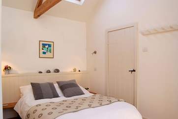 The sleeping-area leads to the shower-room.