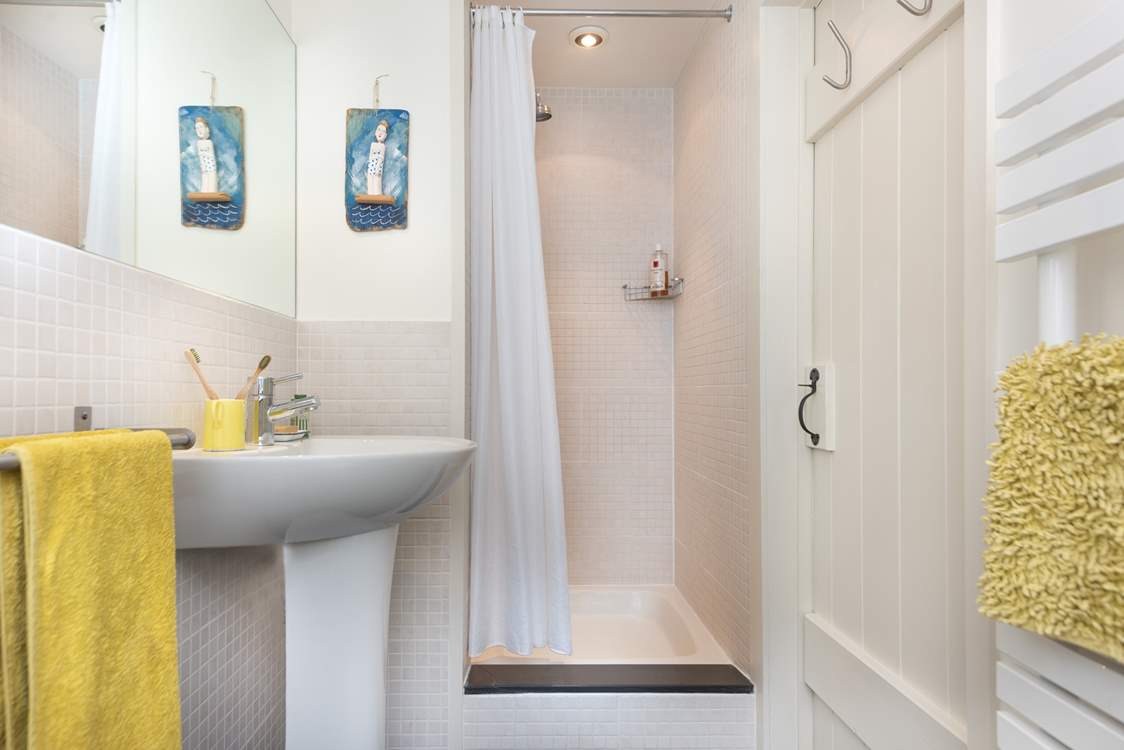 The shower-room is perfect for a refreshing shower after a busy day. Please note the step.