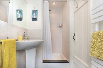 The shower room is perfect for a refreshing shower after a busy day. Please note the step.