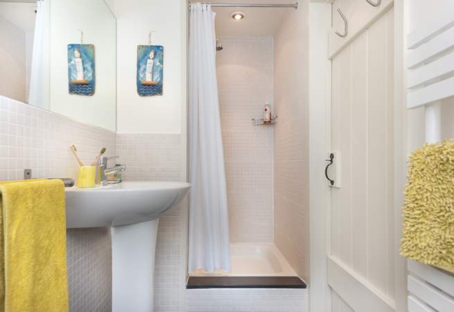 The shower-room is perfect for a refreshing shower after a busy day. Please note the step.