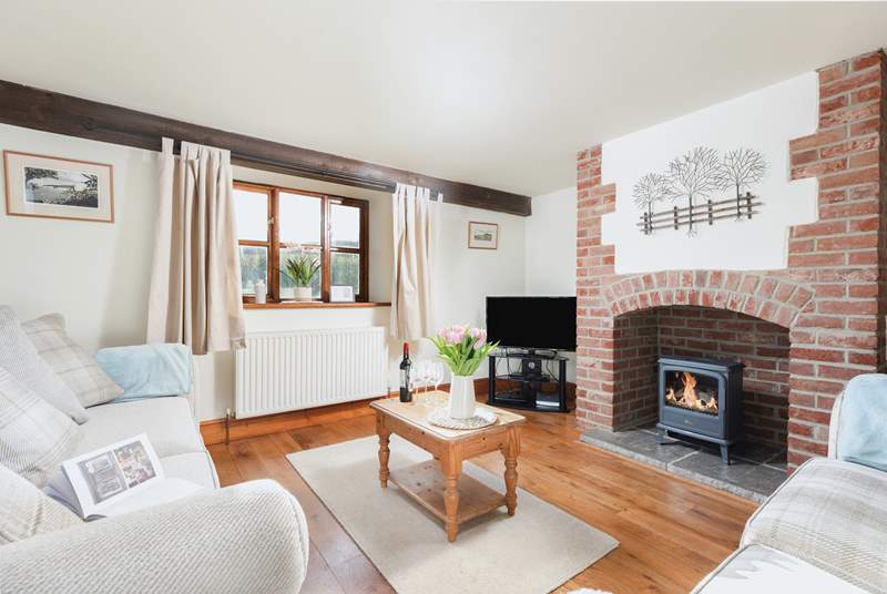 The delightful sitting-room is warmed by a wood-burner keeping you cosy whatever the weather.