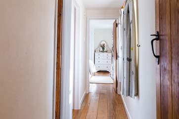 The view up the hallway to the double bedroom from the open plan kitchen/living-room.