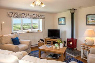 The open plan living space has lovely views towards Gunwalloe.
