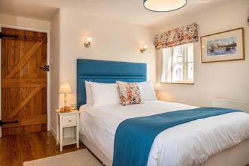 The master bedroom opens to the decking at the front of the property (Bedroom 1).