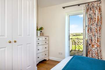 Open up the door to the terrace and let the sea breeze drift in.