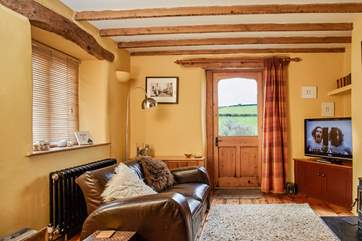 Looking from the kitchen down through the cottage to the garden door beyond.