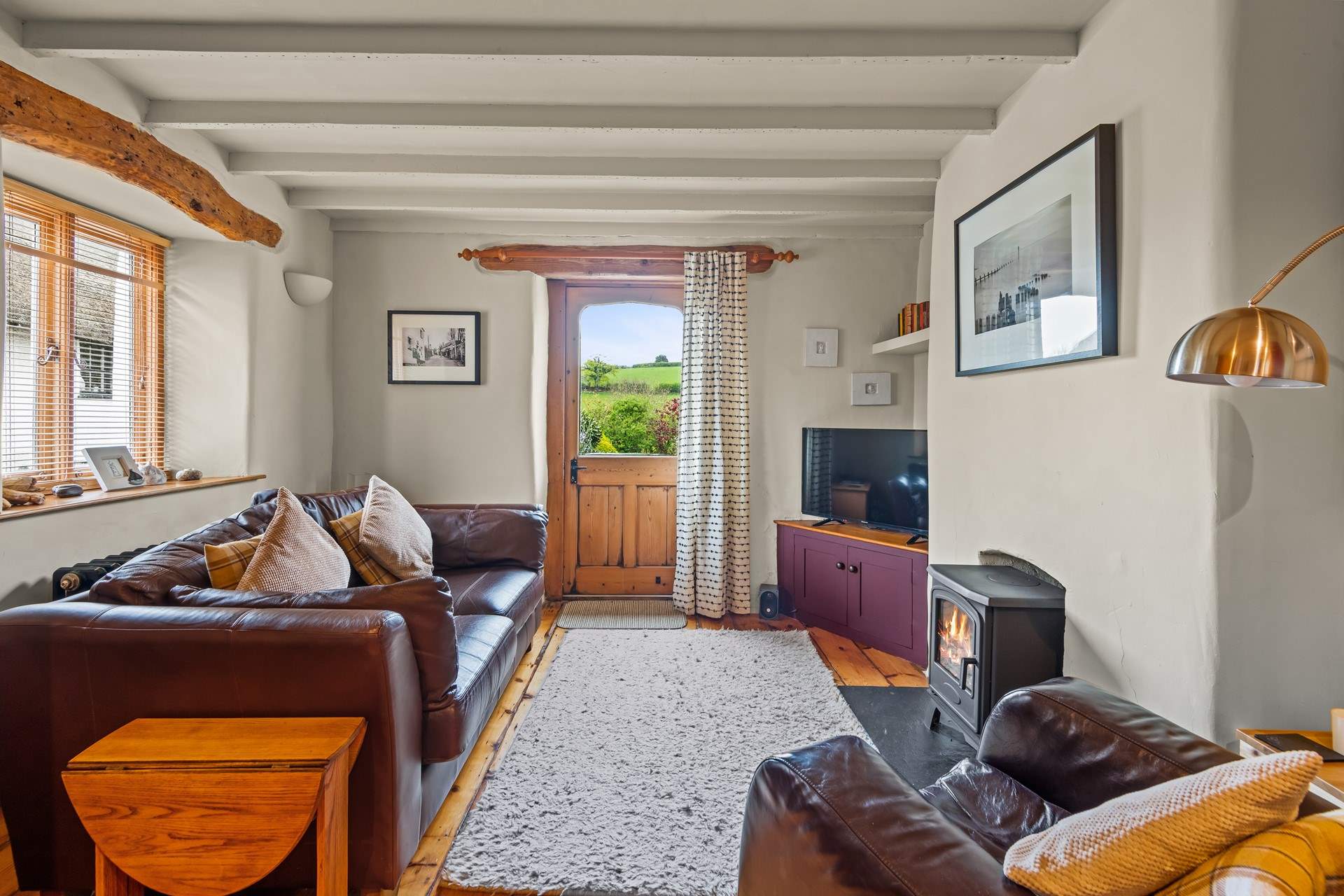 The cosy living-room area. The door leads to the garden.