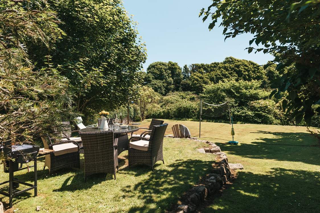The garden is a short walk across the courtyard and has space to play and space to dine outside. Please note, the rattan garden furniture is available Easter to October.