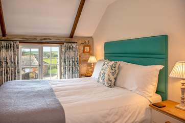 The master bedroom has views across the courtyard (Bedroom 1).