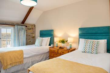 The twin bedroom has lovely coastal colours (Bedroom 2).