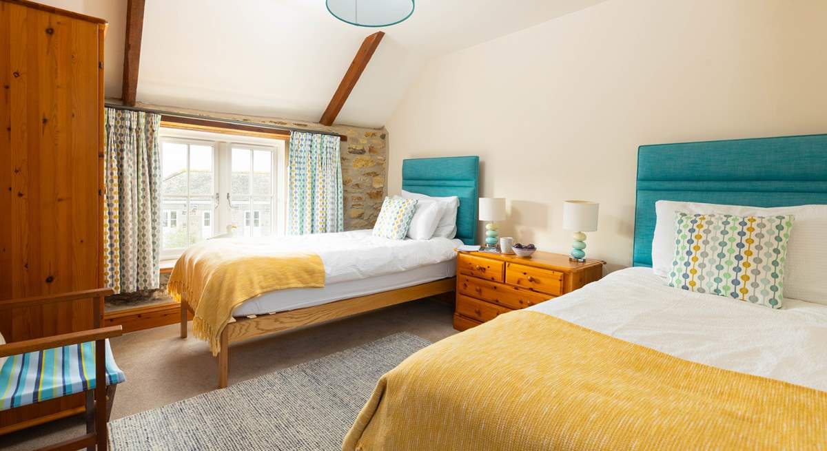 The twin bedroom has lovely coastal colours (Bedroom 2).