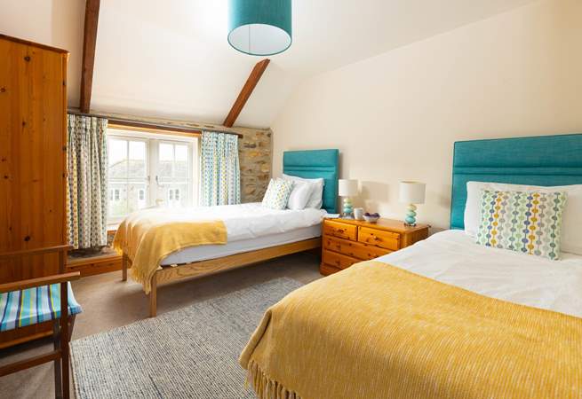 The twin bedroom has lovely coastal colours (Bedroom 2).