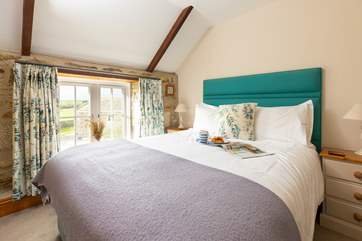 Bedroom 1 has views across the courtyard.