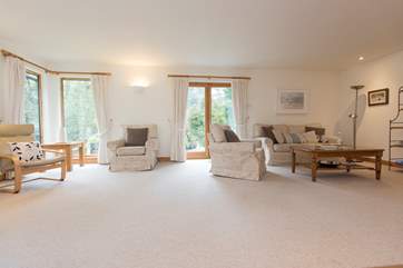 Light floods in from floor to ceiling windows.