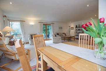 The dining-area sits between sitting and kitchen-areas.