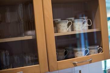 Pretty crockery in the cupboards.