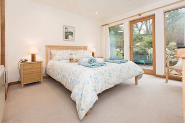 Bedroom 1 has floor to ceiling windows.