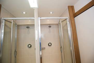 The en suite shower-room in Bedroom 3 (seen twice as reflected in the large mirror!).