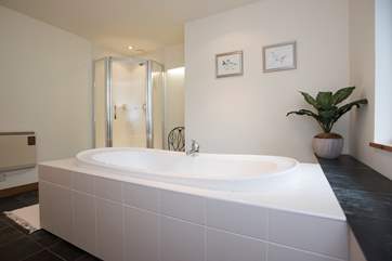 There is a separate shower cubicle in the bathroom.