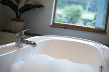 You can soak while enjoying the garden views.