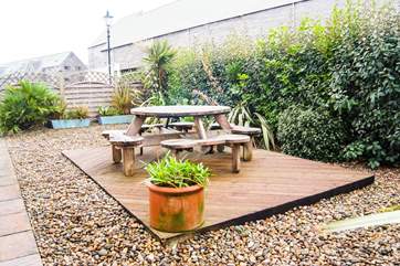 The decked and gravelled garden outside Lock House.