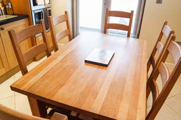 A spacious oak dining-table for relaxed holiday meals.