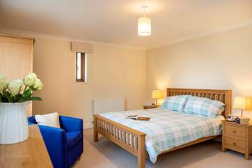 The master bedroom has a king bed and views over the water (Bedroom 2).