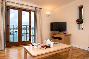 French doors open onto a Juliet balcony with wonderful views.