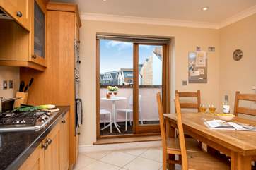The kitchen/ diner has doors out to the small balcony, perfect for the morning coffee.