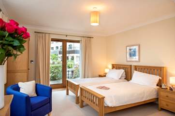 The twin bedroom (Bedroom 1) has doors out to a patio right beside the lock (take care with children).