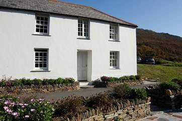 Penally Cottage basks in sunshine as it faces south over the harbour.