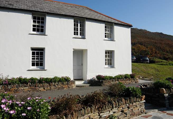 Penally Cottage basks in sunshine as it faces south over the harbour.