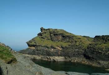 Boscastle's dog-leg harbour leads out to the open sea.