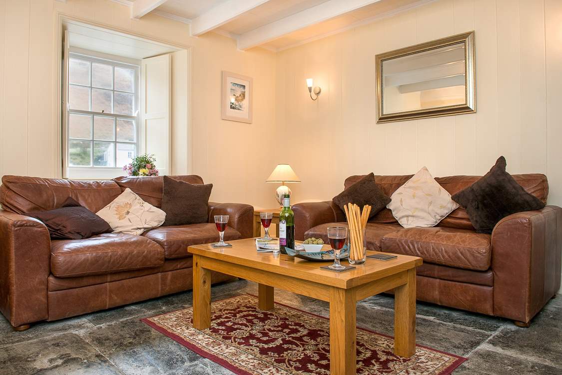 The comfortable sitting-room enjoys the fabulous views of the harbour.