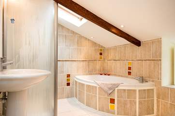 The family bathroom has a bath and a separate shower.