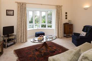 The sitting-room looks over the garden.