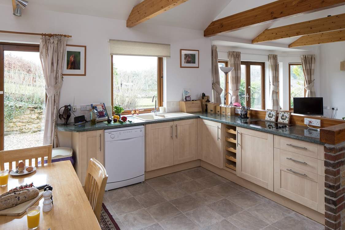 The kitchen is fully equipped and creates a very sociable open space.