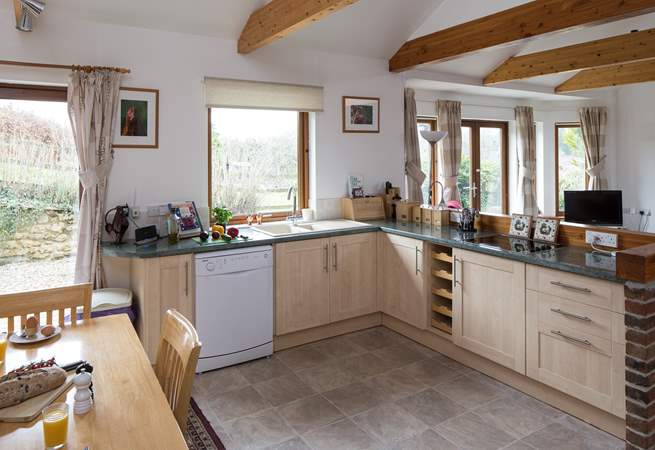 The kitchen is fully equipped and creates a very sociable open space.