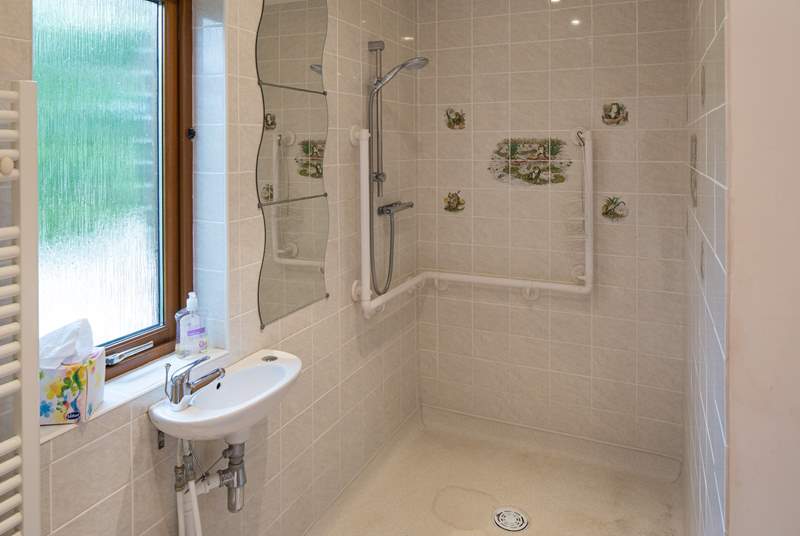 The large wet-room can be accessed via the bathroom, or directly from the hallway.