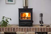 The cosy wood-burner, perfect for a snug night in.