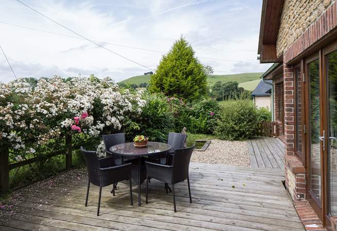 The lovely sheltered terrace has unspoilt countryside views, perfect for al fresco dining.